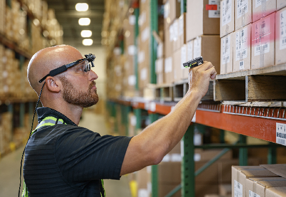 Picture of warehouse worker scanning inventory